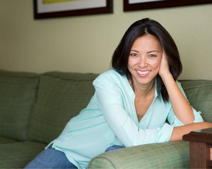 Woman smiling on couch