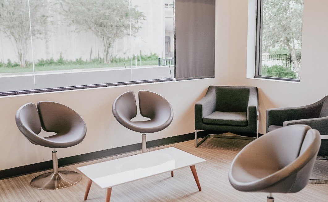 Circular brown chairs by a window