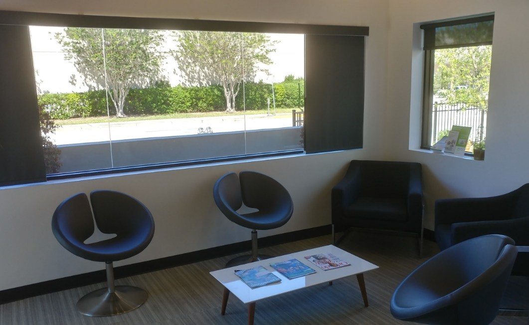 Trees visible through window in waiting area