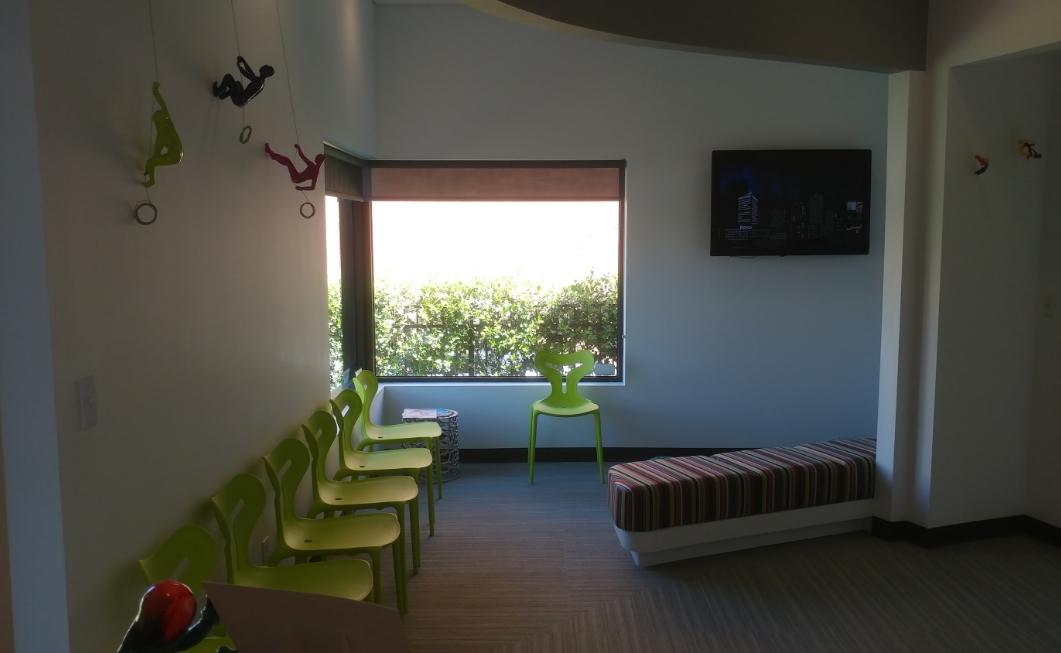 Light green plastic chairs in waiting area