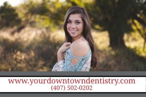 young woman smiling outside